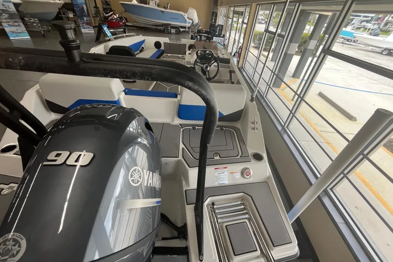Slide: The Image of 2026 Starcraft SV 16 OB boat with Yamaha 90 engine in showroom display. - 24