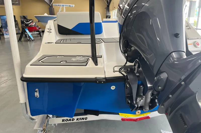 Slide: The Image of 2026 Starcraft SV 16 OB boat with outboard motor, displayed indoors on a trailer. - 5