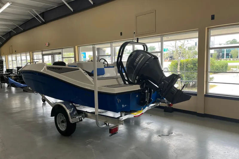 Slide: The Image of 2026 Starcraft SV 16 OB boat with Yamaha outboard motor in showroom. - 7