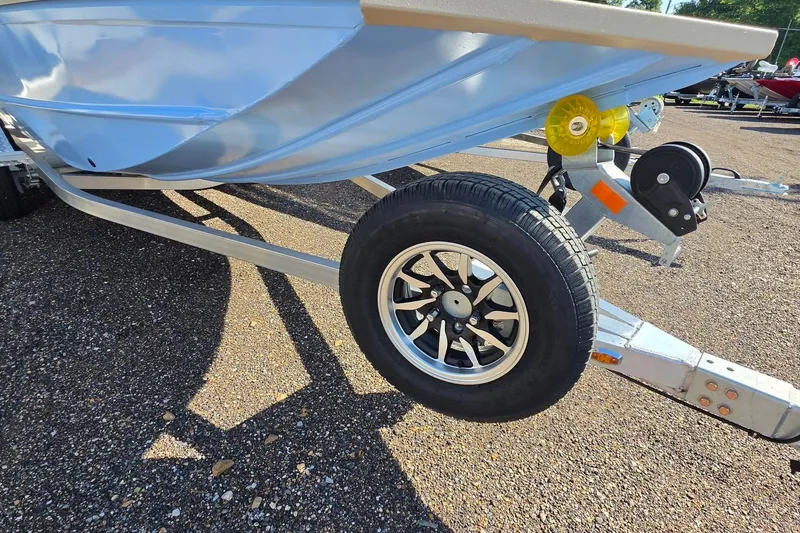 Slide: The Image of 2026 G3 Bay 17 boat console with steering wheel and cushioned seat. - 19