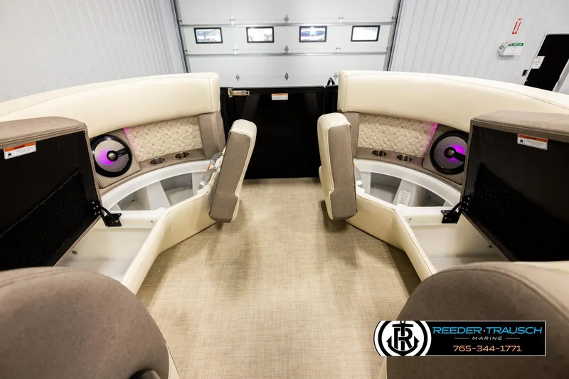 Slide: The Image of Interior of 2026 Alera M23L boat with beige seating and modern sound system. - 19