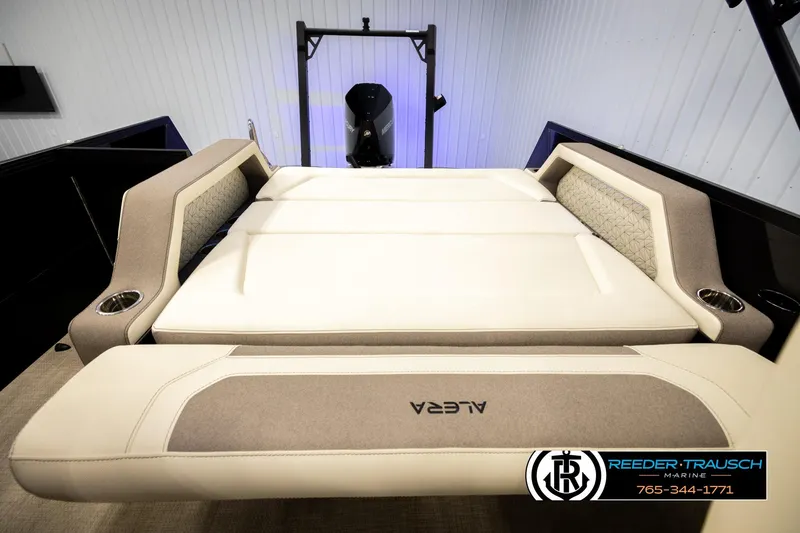 Slide: The Image of 2026 Alera M23L boat interior with luxurious seating and cup holders. - 20