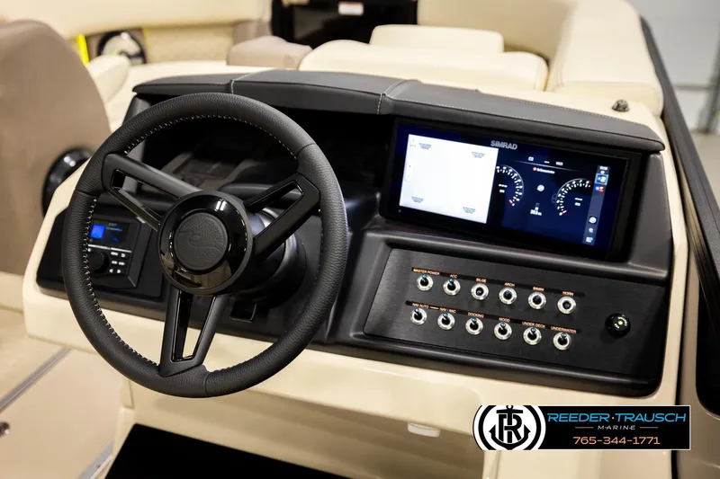 Slide: The Image of Steering console of 2026 Alera M23L boat with digital display and controls. - 32