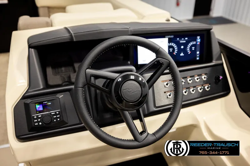 Slide: The Image of Steering console of 2026 Alera M23L boat with digital displays and controls. - 33