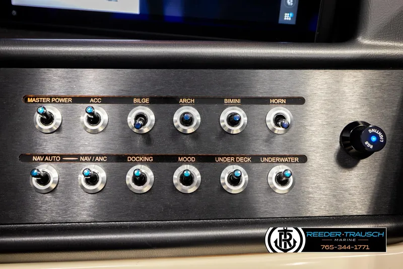 Slide: The Image of Control panel of Alera M23L 2026 boat with labeled switches and lighting knob. - 38