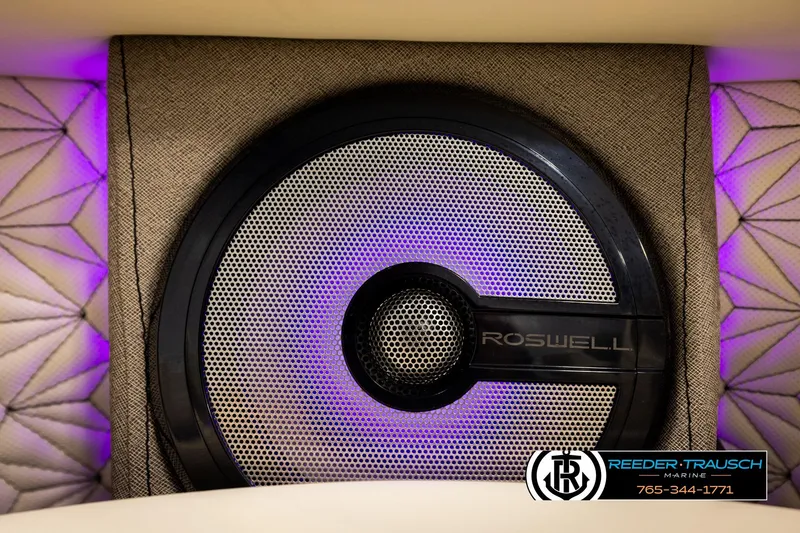 Slide: The Image of Speaker system in Alera M23L 2026 boat with purple LED lighting and quilted upholstery. - 44