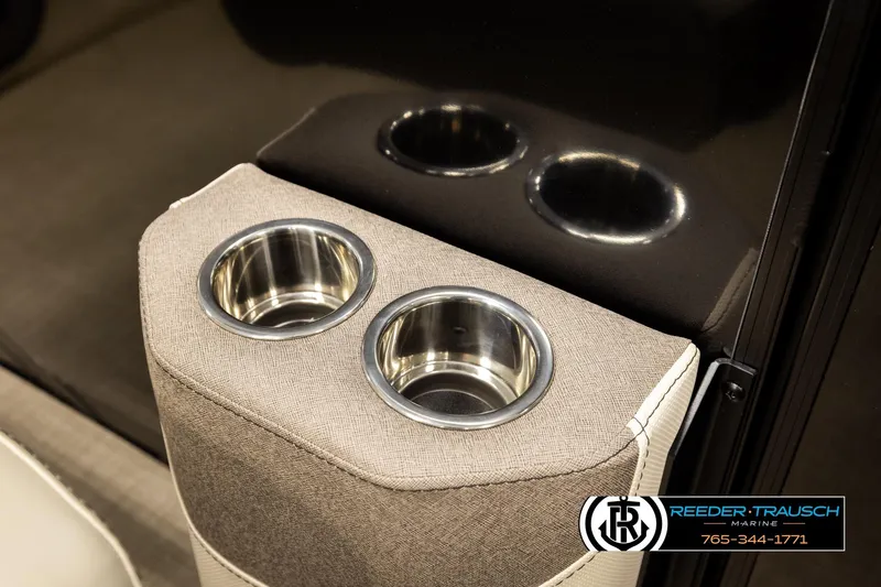 Slide: The Image of Cup holders in a 2026 Alera M23L boat interior, featuring sleek stainless steel design. - 46