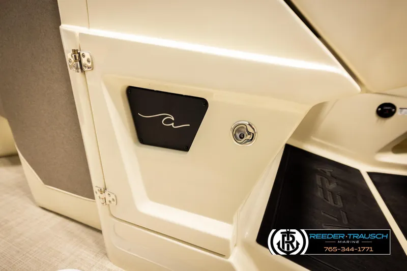 Slide: The Image of 2026 Alera M23L boat interior detail with logo and Reeder-Trausch Marine branding. - 50