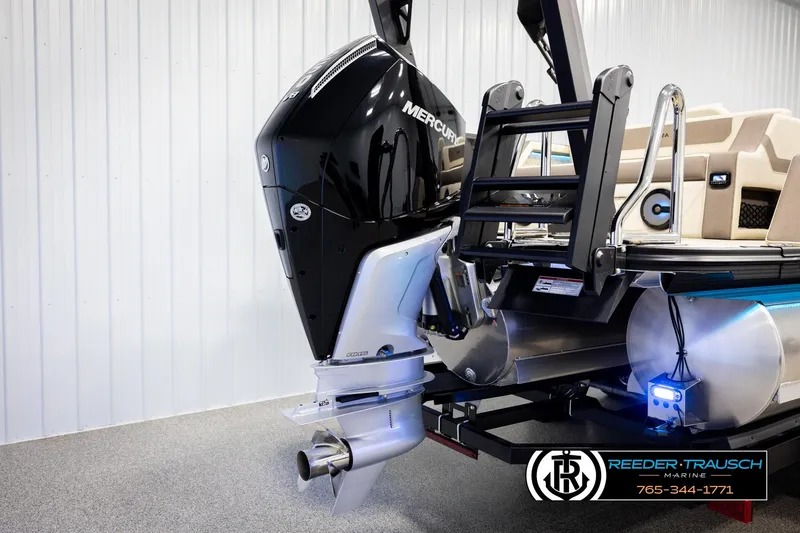 Slide: The Image of Alera M23L 2026 boat with Mercury outboard motor in showroom setting. - 54