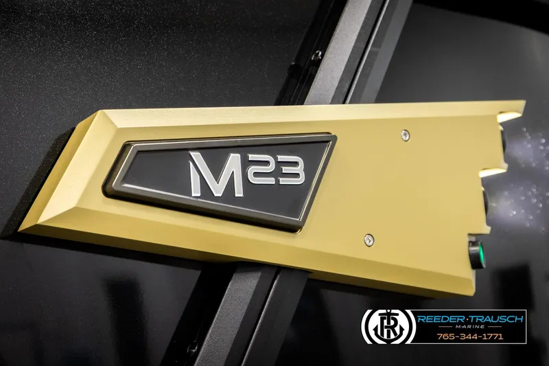 Slide: The Image of 2026 Alera M23L emblem on sleek black surface, featuring Reeder-Trausch Marine branding. - 58