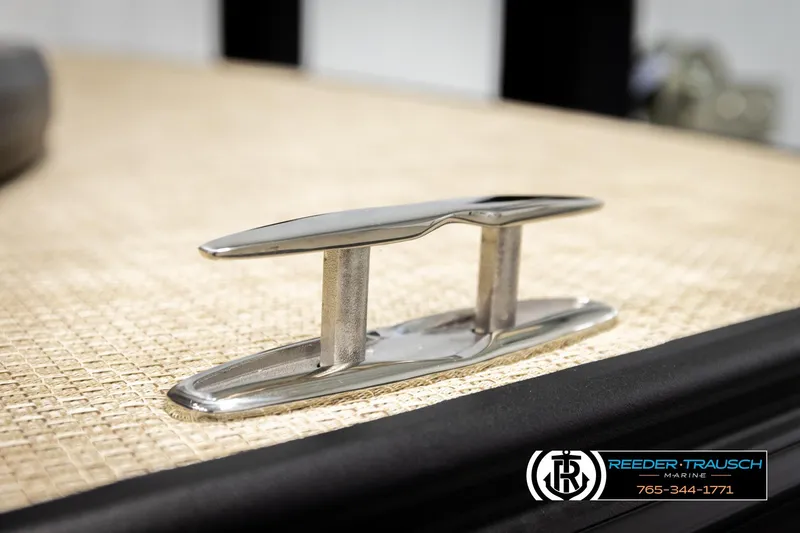 Slide: The Image of Stainless steel cleat on Alera M23L boat, 2026 model, with Reeder-Trausch Marine branding. - 62