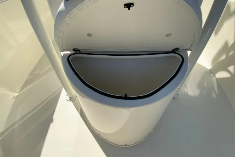 Slide: The Image of Open storage compartment on 2026 Cobia 220 Center Console boat. - 28