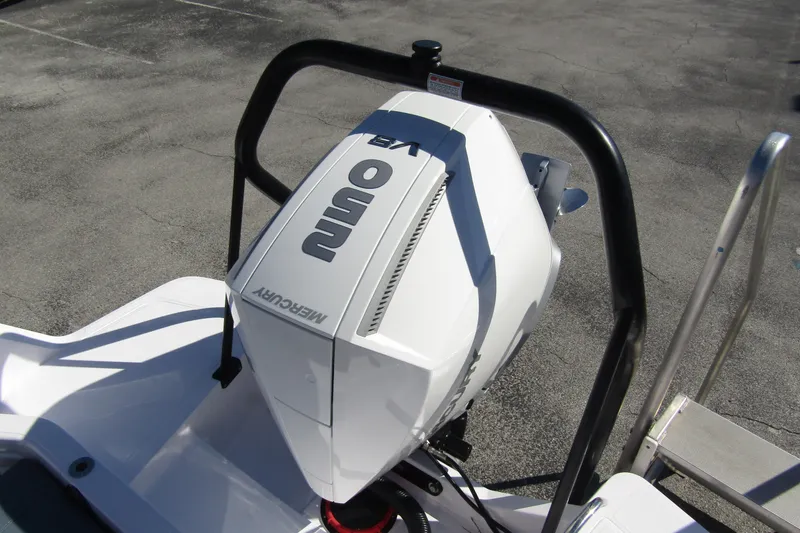 Slide: The Image of 2024 Axopar 25 Cross Top with Mercury outboard engine, viewed from above. - 25