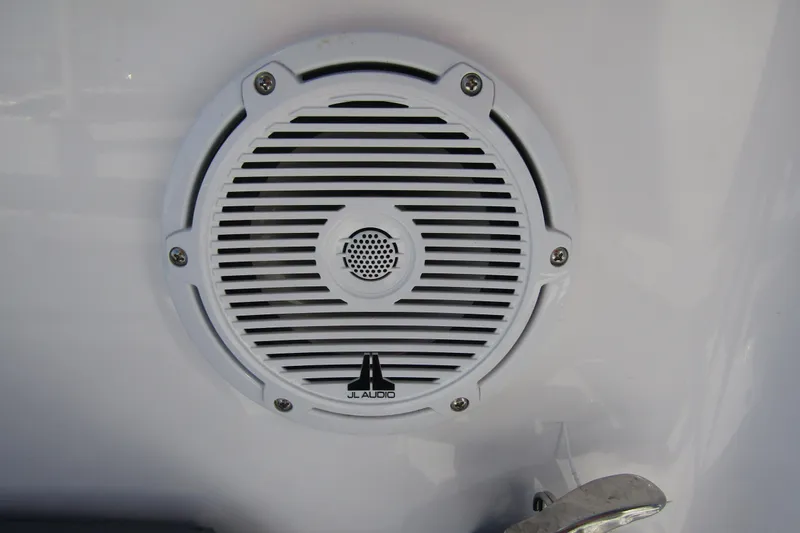 Slide: The Image of White JL Audio speaker on 2024 Axopar 25 Cross Top boat. - 28