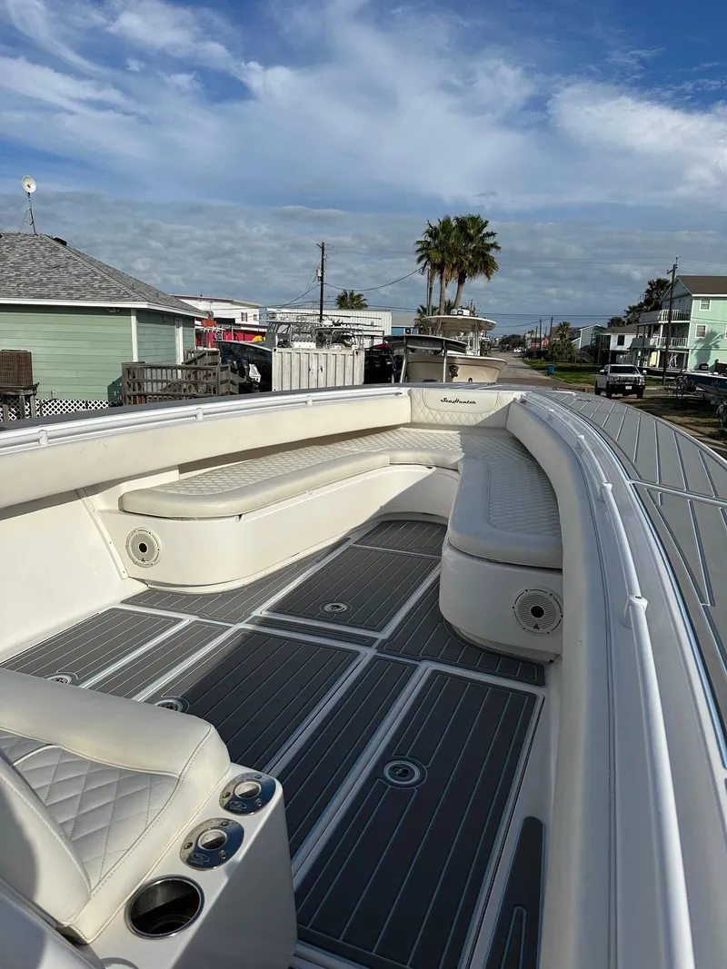 Slide: The Image of 2011 SeaHunter Center Console boat with spacious seating and modern design. - 10