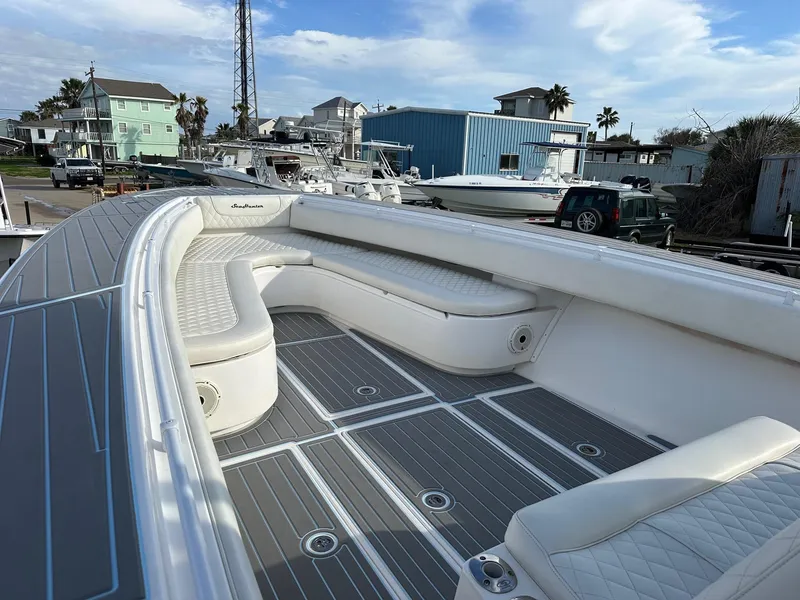 Slide: The Image of 2011 SeaHunter Center Console boat with spacious seating and modern design. - 11