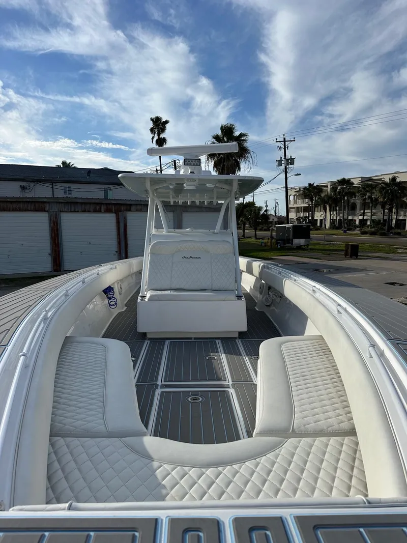 Slide: The Image of 2011 SeaHunter Center Console boat with white seating and open deck. - 12