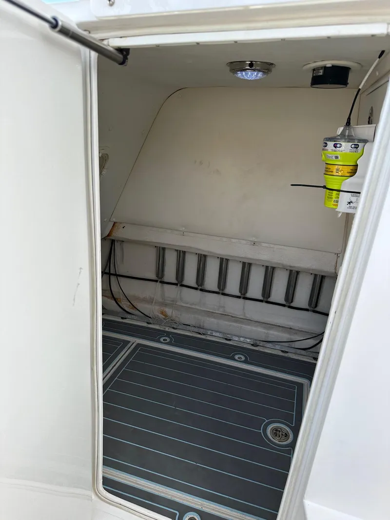 Slide: The Image of 2011 SeaHunter Center Console interior cabin with storage and equipment. - 13