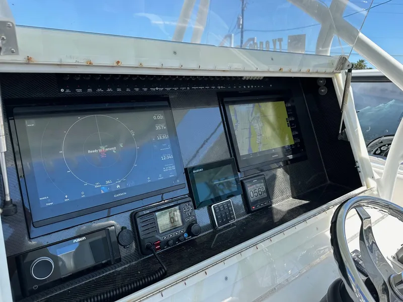 Slide: The Image of 2011 SeaHunter Center Console boat dashboard with navigation and radar screens. - 4