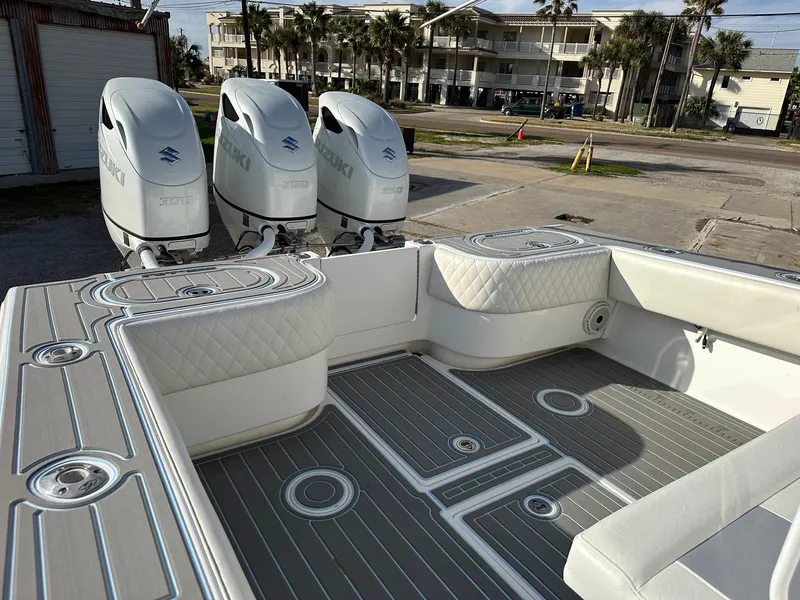 Slide: The Image of 2011 SeaHunter Center Console boat with triple Suzuki outboard engines. - 7