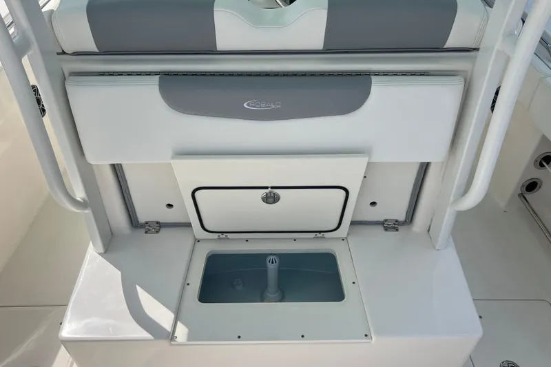 Slide: The Image of 2020 Robalo R302 Center Console boat interior with storage compartments and seating. - 10