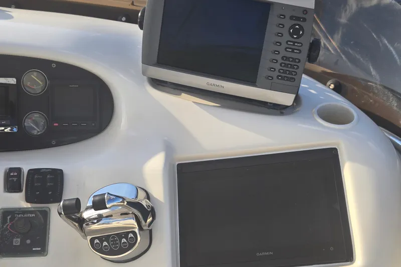 Slide: The Image of Control panel of a 1997 Sunseeker Manhattan 48 yacht with Garmin navigation equipment. - 16