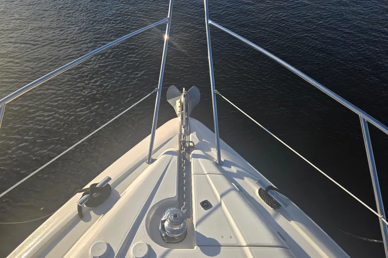 Slide: The Image of Bow view of 1997 Sunseeker Manhattan 48 yacht on calm water. - 30