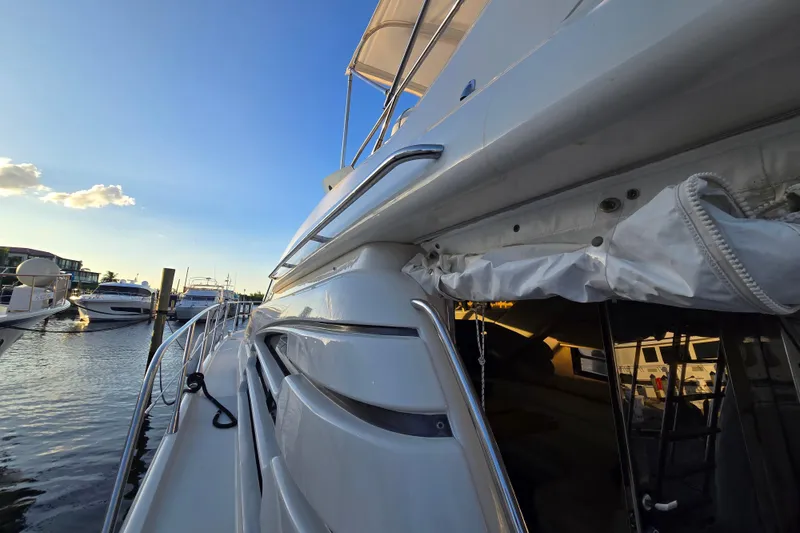 Slide: The Image of Sunseeker Manhattan 48 yacht docked at marina, showcasing sleek design and luxurious features. - 37