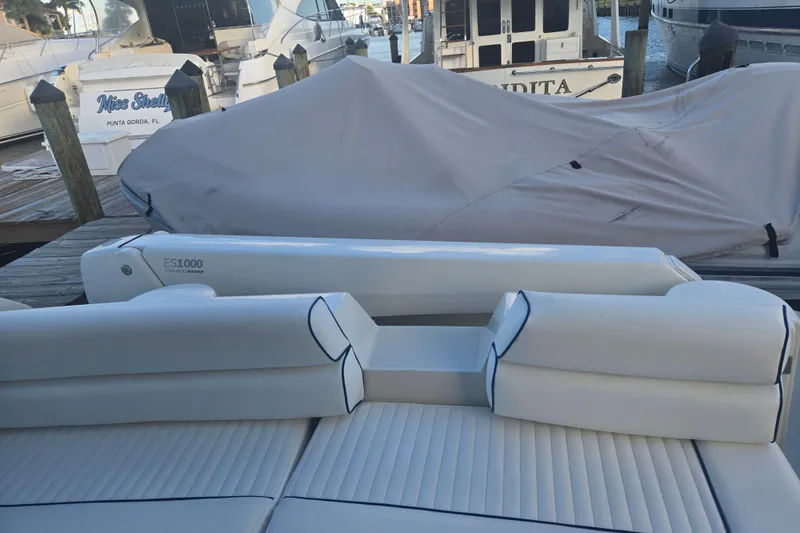 Slide: The Image of Sunseeker Manhattan 48 yacht, 1997 model, docked with covered seating area. - 45