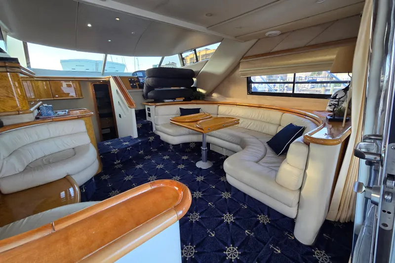 Slide: The Image of Luxurious interior of 1997 Sunseeker Manhattan 48 yacht with elegant seating and nautical decor. - 50