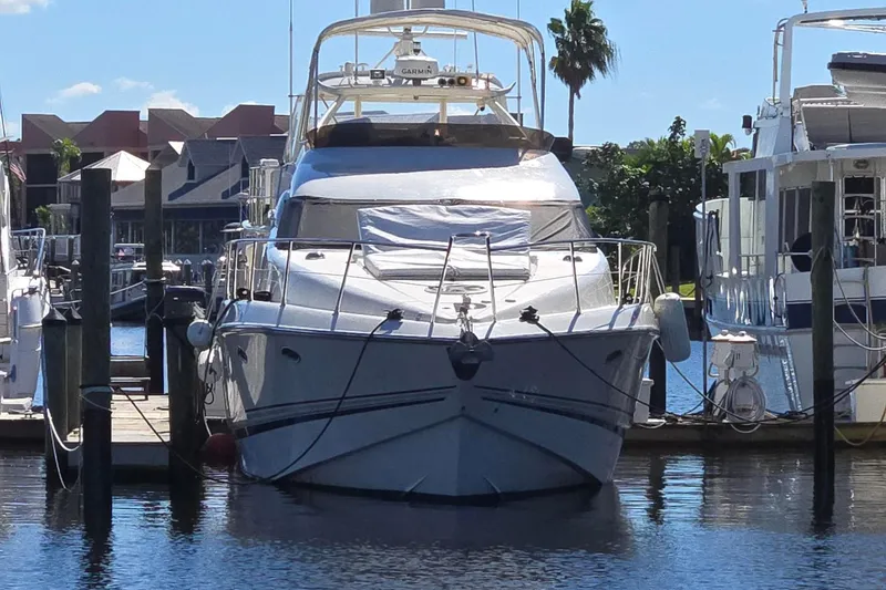 Slide: The Image of Sunseeker Manhattan 48 yacht docked at marina, 1997 model, sunny day. - 6