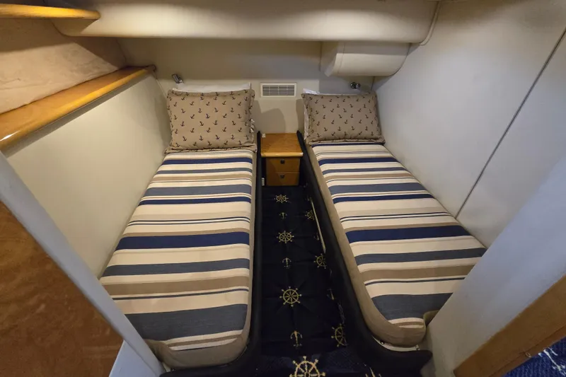 Slide: The Image of Twin cabin with striped bedding in 1997 Sunseeker Manhattan 48 yacht. - 67