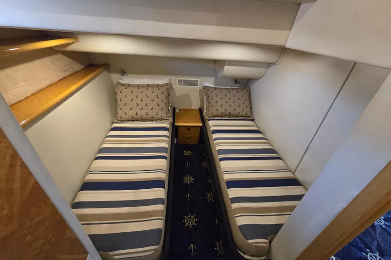 Slide: The Image of Twin cabin with striped bedding in 1997 Sunseeker Manhattan 48 yacht. - 68