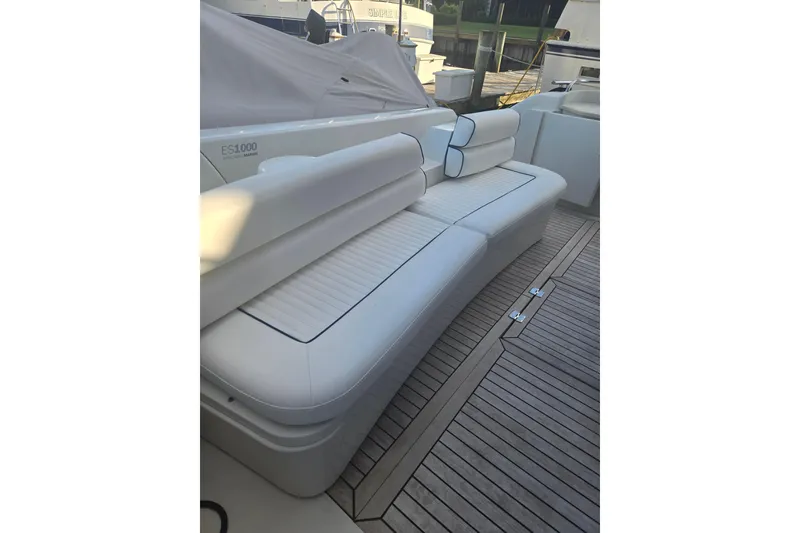 Slide: The Image of Luxurious seating on 1997 Sunseeker Manhattan 48 yacht with sleek white cushions. - 9