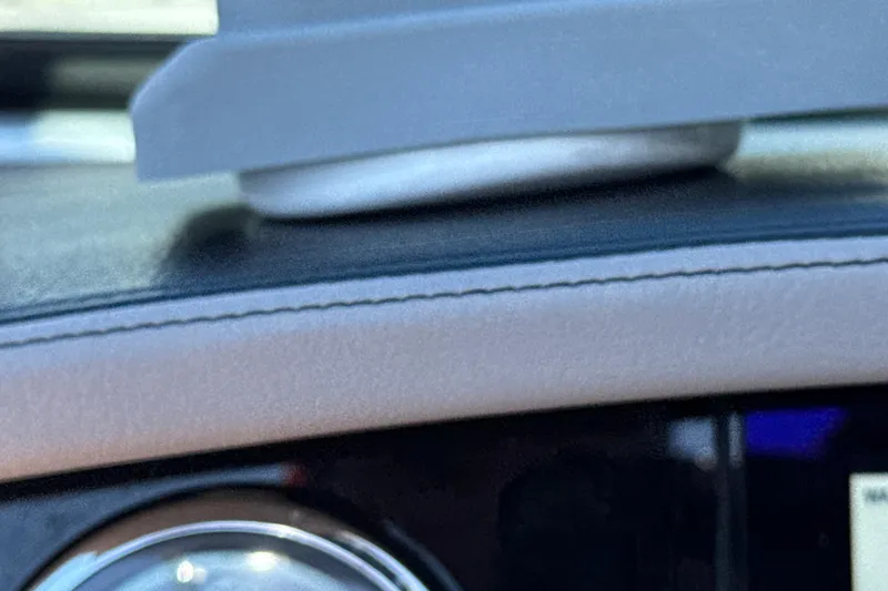 Slide: The Image of Close-up of 2023 Four Winns HD5 OB dashboard detail with stitching. - 10