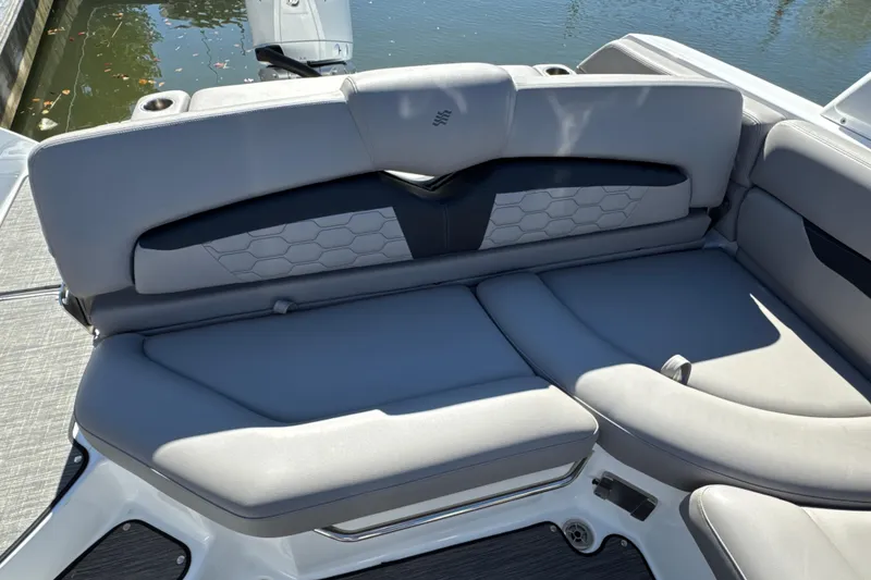 Slide: The Image of 2023 Four Winns HD5 OB boat with luxurious gray seating and stylish design. - 11