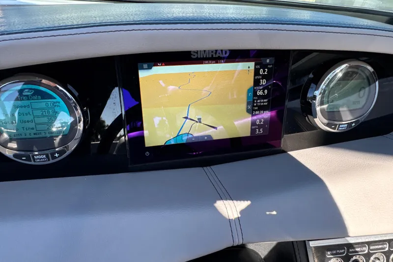 Slide: The Image of Dashboard of 2023 Four Winns HD5 OB boat with navigation and trip data displays. - 15