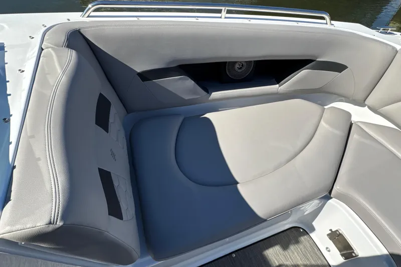 Slide: The Image of 2023 Four Winns HD5 OB boat interior with gray cushioned seating. - 22