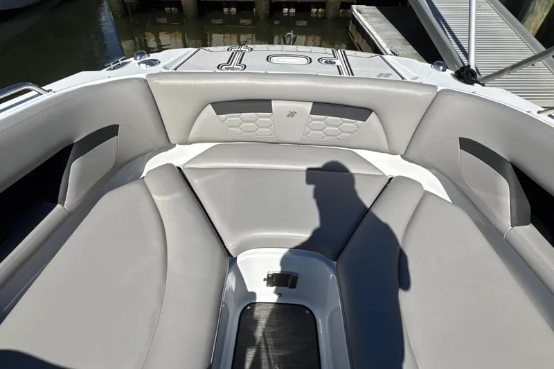 Slide: The Image of 2023 Four Winns HD5 OB boat interior with gray seating and modern design. - 24