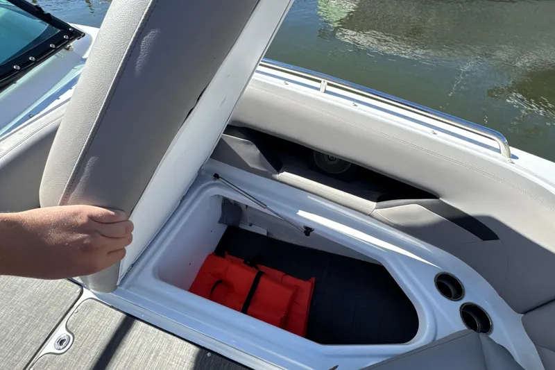 Slide: The Image of 2023 Four Winns HD5 OB boat seat storage with life jacket inside. - 26