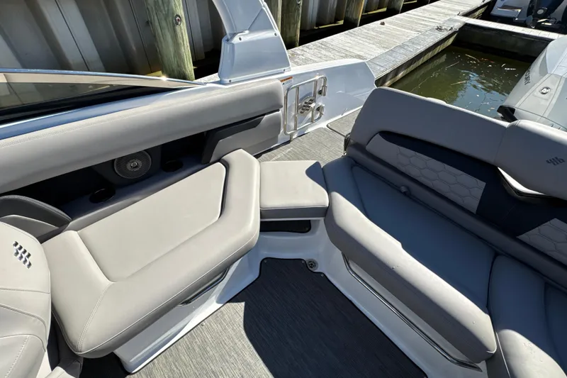 Slide: The Image of 2023 Four Winns HD5 OB boat interior with gray seating and modern design. - 31
