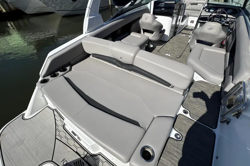 Slide: The Image of 2023 Four Winns HD5 OB boat interior with gray seating and modern design. - 33