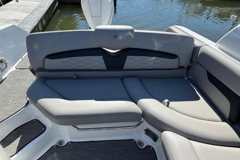 Slide: The Image of 2023 Four Winns HD5 OB boat with sleek gray seating and modern design. - 5