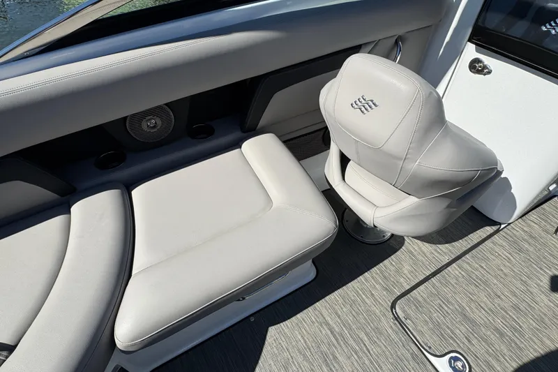 Slide: The Image of 2023 Four Winns HD5 OB boat interior with gray seating and modern design. - 7