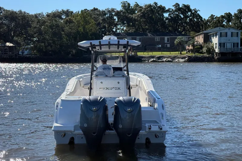 Slide: The Image of 2022 Sea Fox 288 Commander boat on a sunny river, rear view. - 11