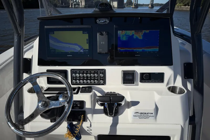 Slide: The Image of 2022 Sea Fox 288 Commander dashboard with navigation and control systems. - 12