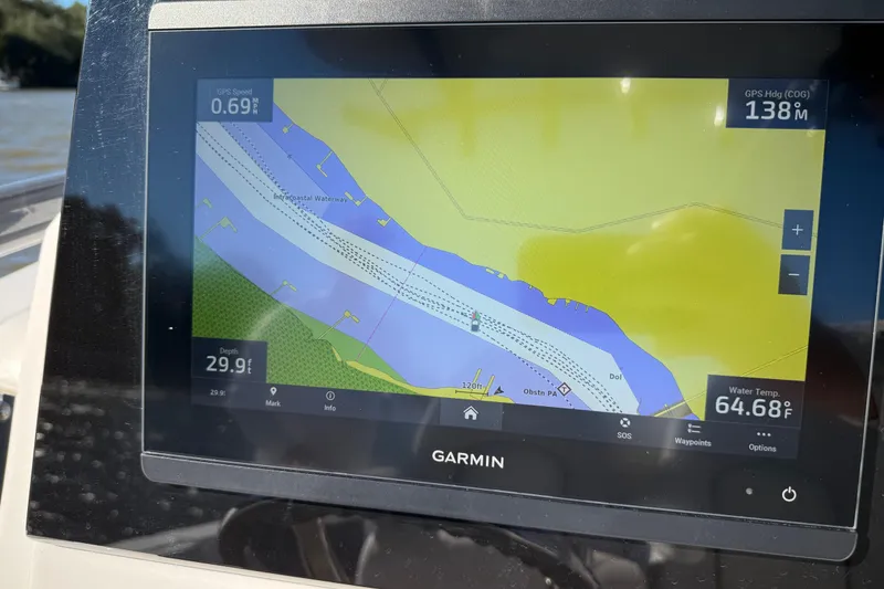 Slide: The Image of Garmin navigation display on 2022 Sea Fox 288 Commander, showing waterway map and data. - 13