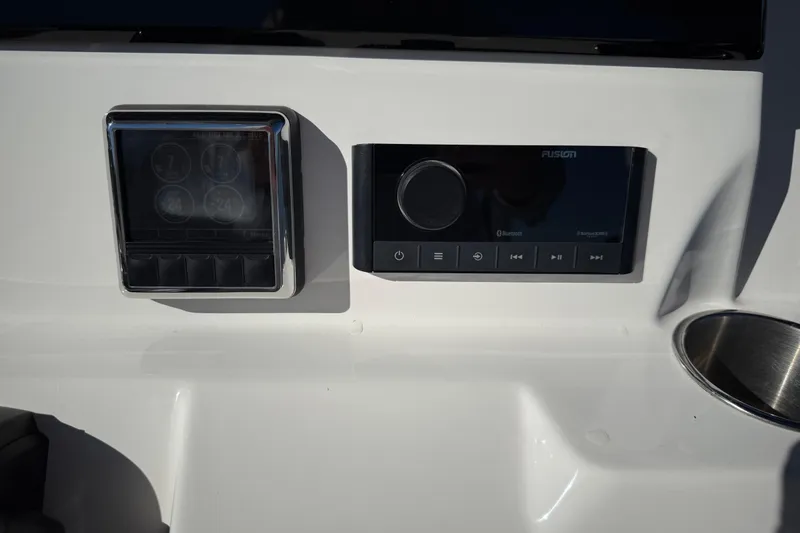 Slide: The Image of Control panel on 2022 Sea Fox 288 Commander boat dashboard with audio system. - 16