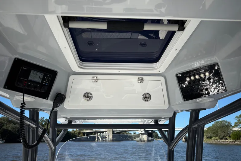 Slide: The Image of Interior view of 2022 Sea Fox 288 Commander boat console with electronics and storage. - 18