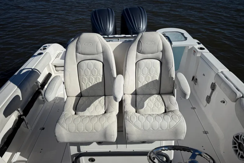 Slide: The Image of 2022 Sea Fox 288 Commander boat with luxurious dual captain's chairs on deck. - 21
